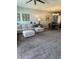 Open-concept living area with a sectional sofa and a dining table set at 409 Ruths Blvd, Woodstock, GA 30188