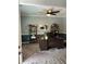 Home office featuring a large desk, shelving, and a comfortable workspace at 409 Ruths Blvd, Woodstock, GA 30188