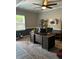 This is a home office area featuring a desk, chair, and natural light through a window at 409 Ruths Blvd, Woodstock, GA 30188