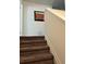 Carpeted staircase leading to the upper level of the home with white trim at 409 Ruths Blvd, Woodstock, GA 30188