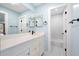 Modern bathroom features a white vanity with black hardware and a large mirror at 845 Lake Hollow Sw Blvd, Marietta, GA 30064