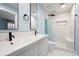 Modern bathroom features dual sinks, sleek fixtures, and a step-in shower with bench at 845 Lake Hollow Sw Blvd, Marietta, GA 30064