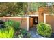 Attractive home boasting a cozy entrance with a fenced front yard featuring lush greenery and a one-car garage at 845 Lake Hollow Sw Blvd, Marietta, GA 30064