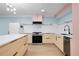 Bright modern kitchen with stainless steel appliances, center island, light wood cabinets, and stylish decor at 845 Lake Hollow Sw Blvd, Marietta, GA 30064