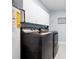 Laundry Room with side-by-side washer and dryer and storage cabinets above at 845 Lake Hollow Sw Blvd, Marietta, GA 30064