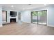 Cozy living room featuring a fireplace, large windows for natural light, and wood-style flooring at 845 Lake Hollow Sw Blvd, Marietta, GA 30064