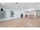 Spacious living room featuring light blue walls, open shelving, and an open-concept layout with a kitchen at 845 Lake Hollow Sw Blvd, Marietta, GA 30064
