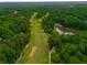 Overhead view of golf course community, mature trees, ponds, and beautiful landscaping at 110 Fairway Ridge Dr, Johns Creek, GA 30022
