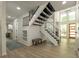 Grand foyer with a double staircase and a bright, open floor plan at 110 Fairway Ridge Dr, Johns Creek, GA 30022