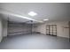 Spacious two car garage features epoxy flooring, ample lighting and peg board at 110 Fairway Ridge Dr, Johns Creek, GA 30022