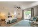 Relaxing main bedroom featuring light hardwood floors, ceiling fan, and sliding glass doors to deck at 110 Fairway Ridge Dr, Johns Creek, GA 30022