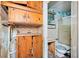 Damaged bathroom featuring a shower with white tile and wooden cabinets at 2180 Rexford Dr, Decatur, GA 30034