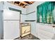 Retro kitchen featuring appliances and a back door; awaiting a complete makeover at 2180 Rexford Dr, Decatur, GA 30034