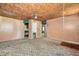 Open room with unique ceiling, neutral walls, and potential for customization and modernization at 2180 Rexford Dr, Decatur, GA 30034