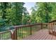 Back deck overlooks the yard featuring a wood railing and stairs down to the yard at 3193 Trasher Cir, Decatur, GA 30032