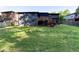 The backyard has a huge green lawn and a wooden deck at 3193 Trasher Cir, Decatur, GA 30032