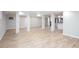 Spacious basement area with light wood floors, white walls, support columns and recessed lighting at 3193 Trasher Cir, Decatur, GA 30032
