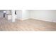 A finished basement with an open floor plan, light wood floors, and a bar area at 3193 Trasher Cir, Decatur, GA 30032