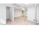 Bright basement with laminate flooring, white columns and a peek into unfinished storage area at 3193 Trasher Cir, Decatur, GA 30032