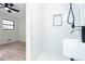 A clean and modern bathroom has a glass shower stall, white tiles, and a black shower fixture at 3193 Trasher Cir, Decatur, GA 30032