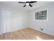 Inviting bedroom with new laminate flooring, fresh paint, ceiling fan, and a window with a backyard view at 3193 Trasher Cir, Decatur, GA 30032
