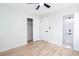 Bright bedroom with two doors, a ceiling fan, a window, and hardwood floors at 3193 Trasher Cir, Decatur, GA 30032