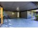 Large covered carport with painted floor and wood accents and access to the home's front door at 3193 Trasher Cir, Decatur, GA 30032