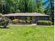 Charming single-story home with a lush, green lawn and mature trees in a tranquil setting at 3193 Trasher Cir, Decatur, GA 30032