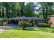 Charming single-story home with a covered carport, fresh landscaping, and a lush green lawn at 3193 Trasher Cir, Decatur, GA 30032