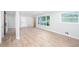 Bright living room featuring large windows, fresh paint, and light, modern flooring at 3193 Trasher Cir, Decatur, GA 30032