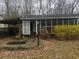 Charming single-story home with a screened-in porch and cozy carport, nestled among trees at 4201 Lindsey Dr, Decatur, GA 30035
