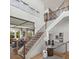 Elegant two-story foyer featuring beautiful staircase and decor at 4815 Ramblewood Dr, Cumming, GA 30028