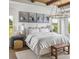 Serene bedroom featuring a cozy bed, decorative chandelier, and ample natural light at 4815 Ramblewood Dr, Cumming, GA 30028