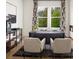 Bright office with a modern desk, cozy chairs, and stylish decor at 4815 Ramblewood Dr, Cumming, GA 30028