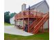 Expansive backyard deck and patio provides ample space for outdoor entertaining and relaxation at 95 Revere Dr, Fairburn, GA 30213