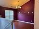Dining room featuring wood floors and a chandelier at 95 Revere Dr, Fairburn, GA 30213