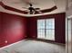 Comfortable main bedroom boasts plush carpeting, ample natural light, and a trey ceiling at 95 Revere Dr, Fairburn, GA 30213
