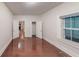 A bedroom with hardwood floors, ample natural light, and access to additional rooms, creating a versatile space at 1100 Welch Sw St, Atlanta, GA 30310