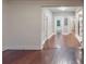 View of hallway with wood floors and laundry machines in the background, enhancing functionality at 1100 Welch Sw St, Atlanta, GA 30310