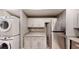 Kitchen area featuring laundry hookups, granite counters, stainless appliances, and ample storage at 1100 Welch Sw St, Atlanta, GA 30310