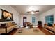 Cozy living room featuring hardwood floors, an artistic display, and lots of natural light at 1100 Welch Sw St, Atlanta, GA 30310
