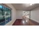 Spacious room with hardwood flooring and a view of the modern appliances in the kitchen at 1100 Welch Sw St, Atlanta, GA 30310