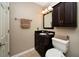 Bathroom featuring granite countertop, dark wood cabinets, and neutral walls at 1507 Paces Ferry North Se, Smyrna, GA 30080