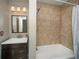 Updated bathroom with a tiled shower and bathtub combination at 1507 Paces Ferry North Se, Smyrna, GA 30080