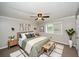Well-lit bedroom with furniture and accent wall decor at 1507 Paces Ferry North Se, Smyrna, GA 30080