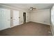 Bedroom with neutral walls, carpet, and open doorway to bathroom at 1507 Paces Ferry North Se, Smyrna, GA 30080