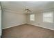 Spacious bedroom with carpet, two windows, and neutral walls at 1507 Paces Ferry North Se, Smyrna, GA 30080