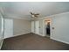 Large bedroom with neutral walls, carpet, and modern ceiling fan at 1507 Paces Ferry North Se, Smyrna, GA 30080