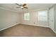 Bedroom featuring carpet, two windows, and neutral walls at 1507 Paces Ferry North Se, Smyrna, GA 30080