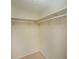 Walk-in closet with white shelving and carpeted floor at 1507 Paces Ferry North Se, Smyrna, GA 30080